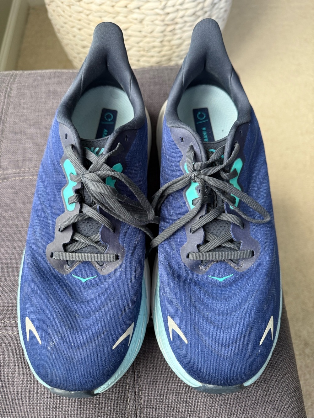 Hoka Navy and Teal Running Shoe Pair